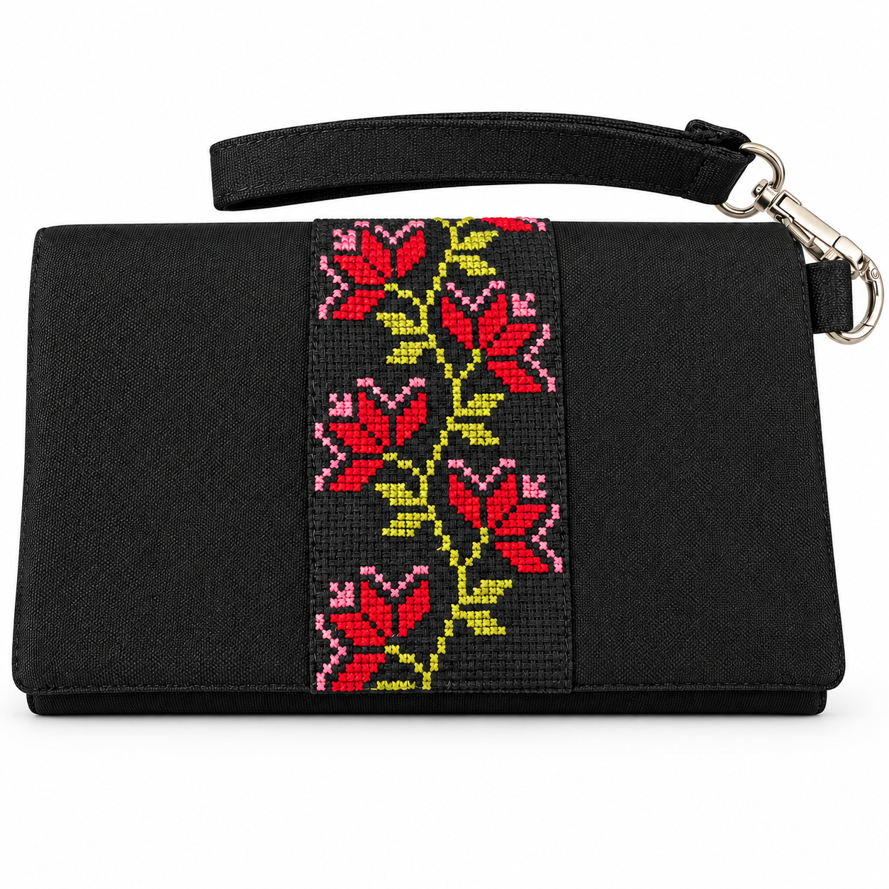 Black handmade Palestinian embroidered clutch with red and pink floral cross-stitch, yellow-green details and a detachable wrist strap.