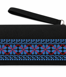 : Hand-embroidered clutch with a repeating blue geometric band with red diamond outlines and narrow blue borders, shown on a white background with a wrist strap.