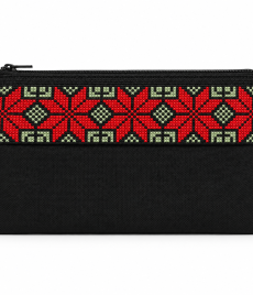 Handmade black embroidered zipper pouch with red geometric cross-stitch pattern